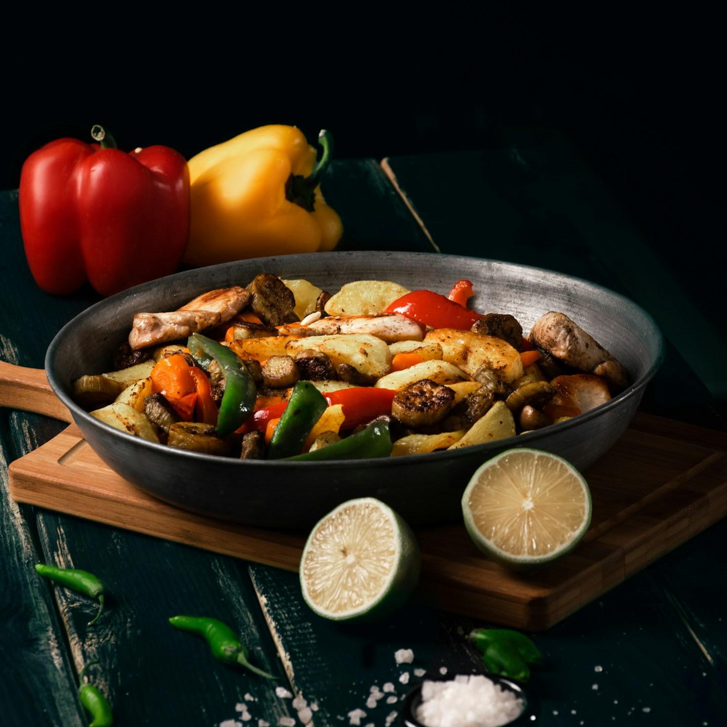 Diverse group of community members sharing a meal together, showcasing the social bonds formed through collaborative cooking